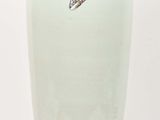 a white vase with a butterfly on it on a white background