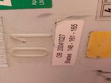a picture of a close up of a gas tank with stickers on it