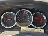 three gauges on the dashboard of a car