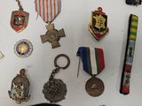 a lot of medals and medals on the table