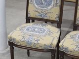 two chairs that are sitting next to each other in a room
