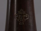 a close up of a vase with a gold emblem on it