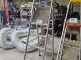 a ladder that is leaning against a wall in a garage