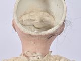 a doll that has a hat on it ' s head