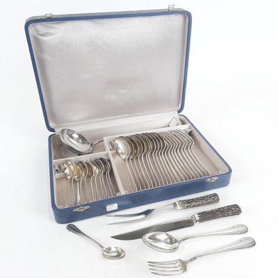 a blue case with silverware in it on a white surface
