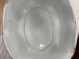 a white bowl sitting on top of a table