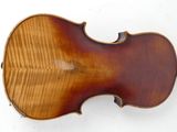 an old violin with a wooden back and a wooden bow