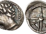 a silver coin with an image of a man on it