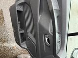 an image of a car door with the door handle missing