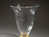 a clear glass vase sitting on top of a table