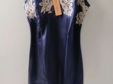 navy blue and white lace camiso with white trim