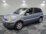 a picture of a small blue car parked in a garage