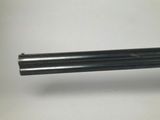 a close up of a gun that is on a table