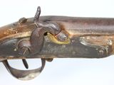 an old gun with a wooden handle on a white background