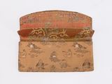 a small purse with a pattern on it