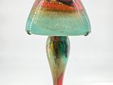 a colorful lamp that is sitting on a table
