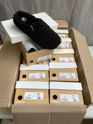 a pile of boxes with a stuffed animal on top of them