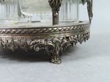 a silver plate with wine glasses on it on a table