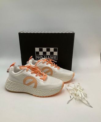 a pair of white and orange sneakers with orange laces