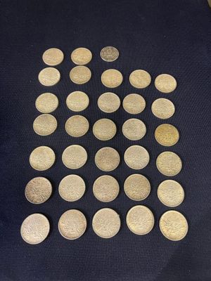 a close up of a pile of coins sitting on top of a table