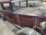 many old cars that are parked in a lot