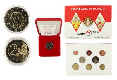a close up of a box of coins with a picture of a monkey