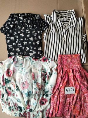 a box filled with three different types of clothes