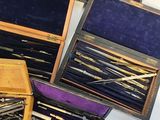 a lot of different types of sewing needles in a box