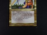 a picture of a card with a picture of a woman holding a sword
