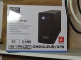 a box on a shelf that has a computer on it
