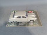 a toy car that is sitting on top of a plastic tray