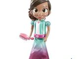 a doll that is holding a comb and a hairbrush