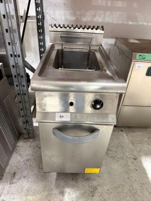 a stainless steel sink and a dishwasher in a warehouse