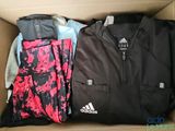 a box full of clothes and a backpack in it