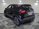a picture of a black car parked in a garage