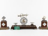 a clock that is sitting on top of a wooden stand