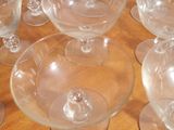 a lot of empty wine glasses sitting on a table