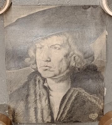 a drawing of a man with a hat on a wall