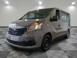 the grey van is parked on a checkered floor in the garage