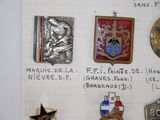 a lot of badges that are on a piece of paper
