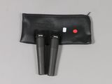 a pair of microphones sitting on top of a black bag