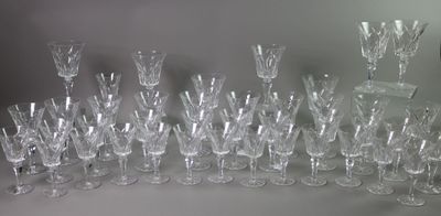 a lot of wine glasses that are sitting on a table