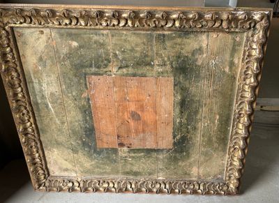 an old picture frame with a wooden square in the middle
