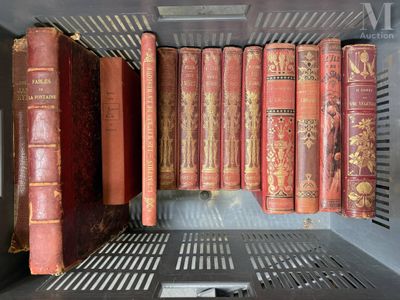 many old books on a shelf in a book case