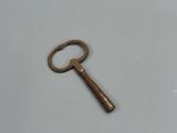 an old key that is laying on the table