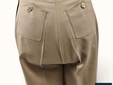 a close up of a person ' s pants with buttons on them