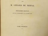 an old book with a black and white title on it