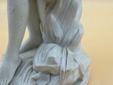 a statue of a woman holding a baby in her arms