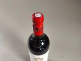 a bottle of wine that is sitting on a table