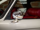 a close up of a car with a mirror on it ' s side